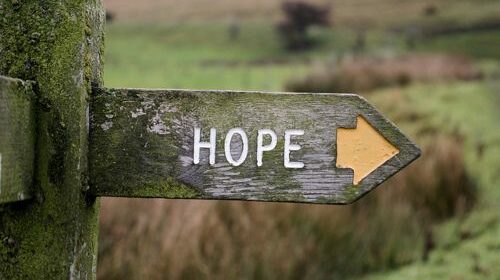 directional street sign with the word Hope engraved